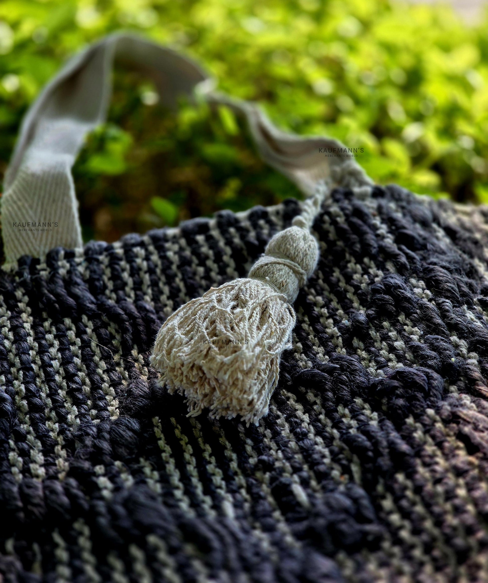 Detail image of black and white jute tote bag.
